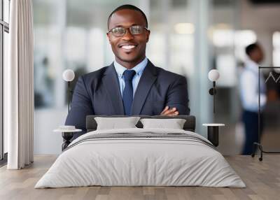 Smiling black executive posing with his arms crossed at the office looking at the camera Wall mural