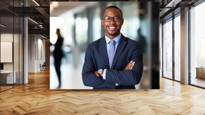 Smiling black executive posing with his arms crossed at the office looking at the camera Wall mural