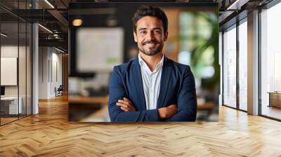 Smiling confident young businessman looking at camera standing in office. Elegant stylish corporate leader successful ceo executive manager.  Wall mural