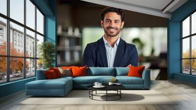 Smiling confident young businessman looking at camera standing in office. Elegant stylish corporate leader successful ceo executive manager.  Wall mural