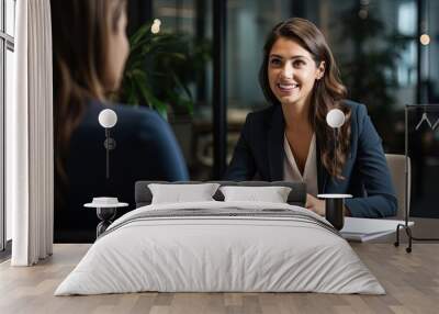 Smiling Female Manager Interviewing an Applicant In Office Wall mural