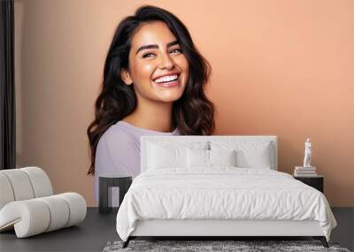 Smiling happy attractive hispanic young woman posing in studio shot Wall mural