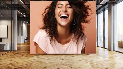 Smiling happy attractive hispanic young woman posing in studio shot Wall mural