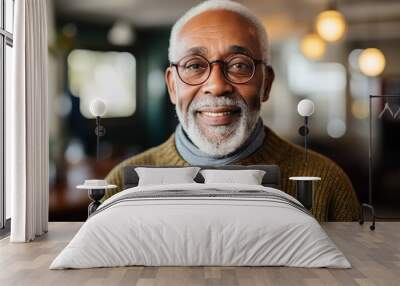 Smiling senior black man posing inside a room looking at the camera Wall mural