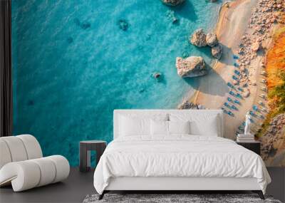 Top view of beach chairs by turquoise sea in Greece Wall mural