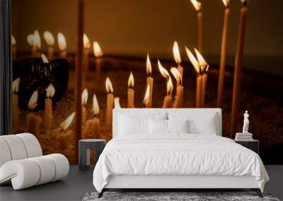 Burning candles in the dark. Shallow depth of field. many candles burning, all soul's day, candlelight	
 Wall mural