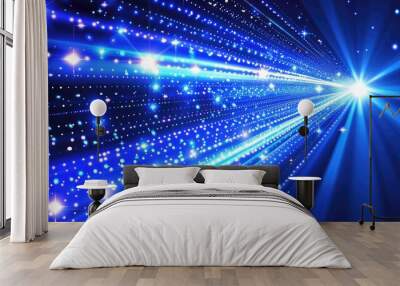 A blue light with a bunch of stars and a bright light in the middle Wall mural