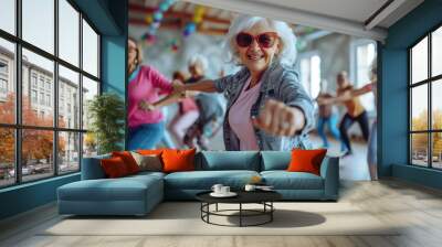 A group of older women are dancing and one of them is wearing sunglasses Wall mural