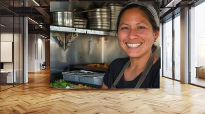 A woman is smiling and standing in front of a food truck Wall mural