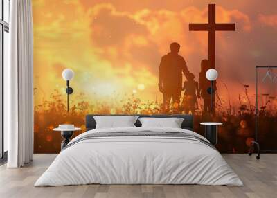 Family silhouette with a cross in a sunset blooming field. Wall mural