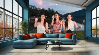 Asian women celebrating, meeting and chatting in a bar. Places to visit, beautiful lights Wall mural