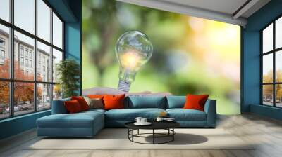 Light bulb Energy saving green nature background Wall mural