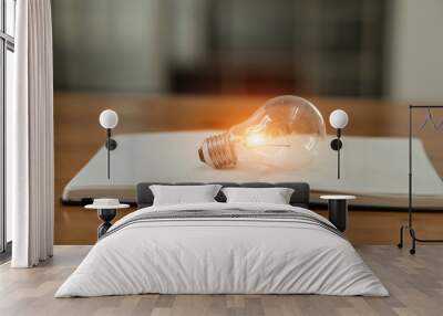 light bulb on table, energy saving concept Wall mural