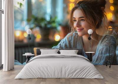 woman working on a laptop in cozy office. Wall mural