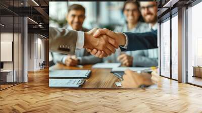 Young business people meeting office handshake hand shake shaking hands teamwork group contract signing agreement document signature paperwork success corporate senior mature. Wall mural