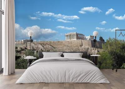 Acropolis hill and the Parthenon, Attica, Greece. Famous old Acropolis hill is a top landmark of Athens on a spring cloudy morning with deep blue sky Wall mural