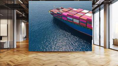 Aerial drone panoramic ultra wide photo of industrial container tanker ship loaded with colourful truck size containers cruising open ocean deep blue sea Wall mural