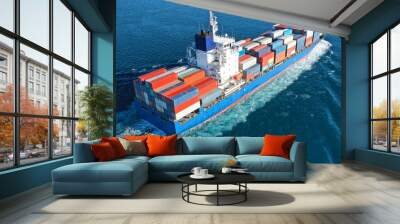 Aerial drone photo of colourful truck size container tanker ship cruising deep blue sea near commercial port of Piraeus, Attica, Greece Wall mural