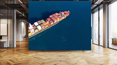 Aerial drone photo of industrial cargo container carrier cruising the open ocean deep blue sea Wall mural