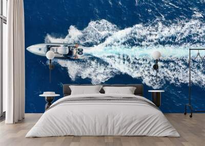 Aerial drone photo of luxury rigid inflatable speed boat cruising in high speed in Aegean deep blue sea, Greece Wall mural