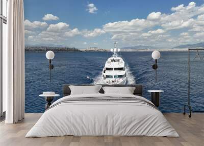 Aerial drone photo of luxury yacht cruising in deep blue Aegean sea Wall mural