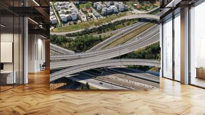 Aerial drone photo of multilevel highway intersection junction toll road outside city urban center Wall mural