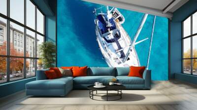 Aerial drone top view photo of sail boat docked in tropical exotic bay with turquoise calm sea Wall mural