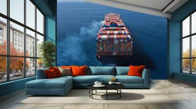 Aerial drone ultra wide photo above huge colourful container carrier vessel cruising deep blue open ocean sea Wall mural