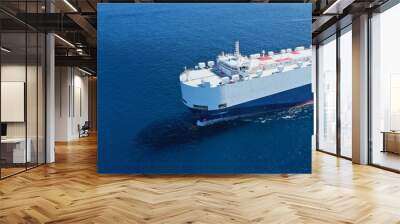 Aerial drone ultra wide photo of huge car carrier ship RO-RO (Roll on Roll off) cruising in Mediterranean deep blue Aegean sea Wall mural