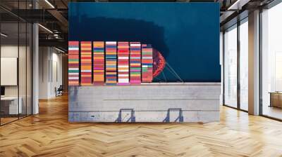 Aerial drone ultra wide top down photo of anchored container ship in loading - unloading in logistics terminal port Wall mural