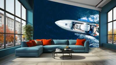 Aerial drone ultra wide top down photo of luxury rigid inflatable speed boat cruising in high speed in Aegean deep blue sea, Greece Wall mural