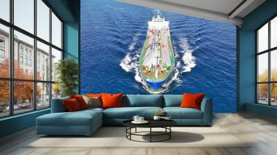 Aerial drone ultra wide top view photo of industrial liquified LPG gas tanker cruising near gas terminal Wall mural