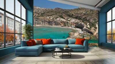 Aerial drone view of iconic volcanic white chalk sandy organised with sun beds and umbrellas beach of Firiplaka with turquoise clear sea and rocky colour formations, Milos island, Cyclades, Greece Wall mural