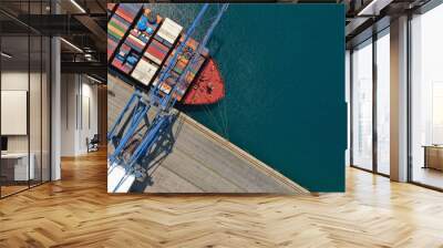 Aerial top down ultra wide photo of industrial cargo container ship loading in logistics terminal port Wall mural