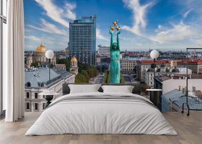 Beautiful sunrise view over Riga by the statue of liberty - Milda in Latvia. The monument of freedom. Wall mural