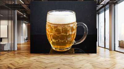 Mug of light beer on dark background. Craft unfiltered beer Wall mural