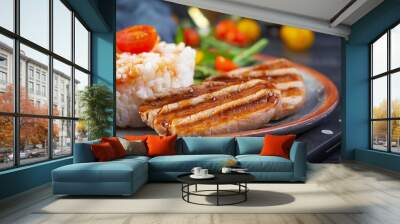 Rice with grilled pork meat, tomatoes and green herbs on dark background Wall mural