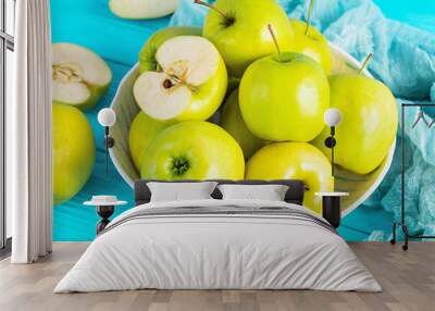 Ripe green apples on a wooden background. Delicious juicy apples Wall mural