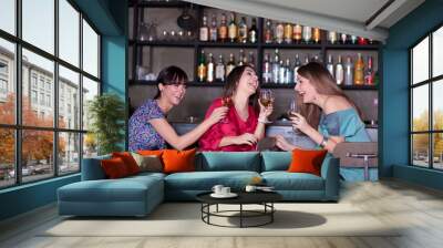 girls enjoying a drink in a bar Wall mural