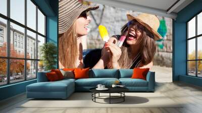 two young women having an ice cream  Wall mural