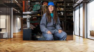 young woman mechanic in a workshop Wall mural