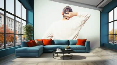 holding his head. The back man Wall mural