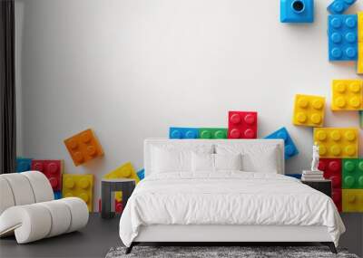 Colorful plastic blocks toy on white background. Wall mural