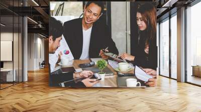 Banner Group of business people meeting in conference room. Panorama Asian businesspeople brainstorm teamwork partnership. Happy teams meeting graph chart business data meeting room with copy space Wall mural