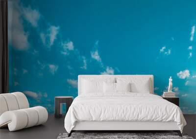 Blue sky fluffy white clouds on summer season bright clear skyline with beautiful cloudscape. Panorama blue sky clouds pattern on daylight with copy space. Cumulus cloudscape air climate sunny day Wall mural