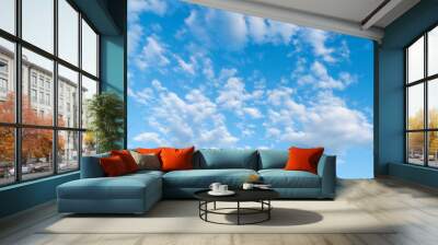 Blue sky fluffy white clouds on summer season bright clear skyline with beautiful cloudscape. Panorama blue sky clouds pattern on daylight with copy space. Cumulus cloudscape air climate sunny day Wall mural