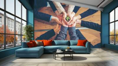 Hand stacked ecosystem human relationships collaboration partners hands together sustainability organization. Green ecosystem company union partners team with hands together holding eco green plant  Wall mural