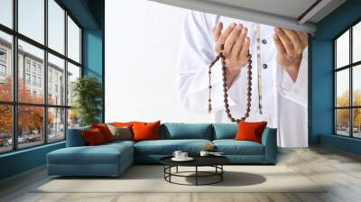 Religious muslim islam man in white session lift two hand for praying to Allah in mosque, isolated on white background.concept for islamic pray, Ramadan, Eid al Fitr, eid ad-ha, meditation Wall mural