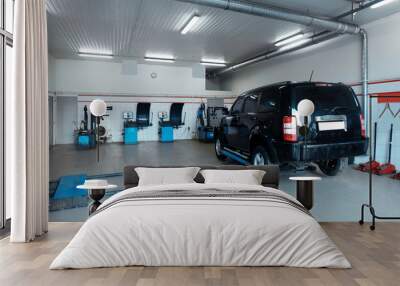 Auto service center interior with car and tire changing station Wall mural