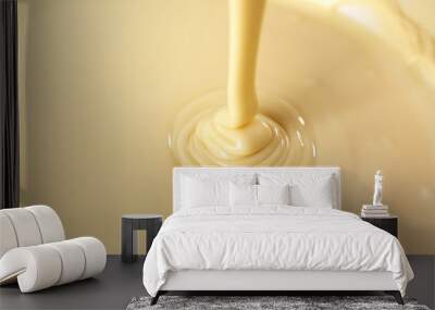 Background of condensed milk in a bowl, close-up Wall mural